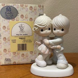 Precious Moments Hug One Another